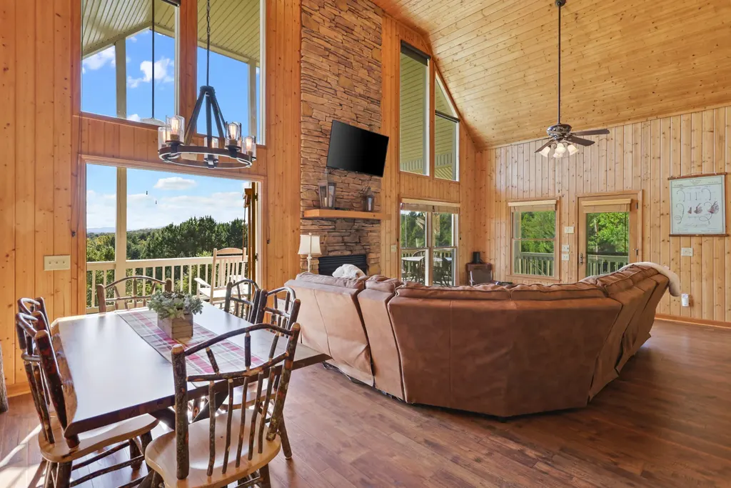 Open living and dining area with vaulted ceilings
