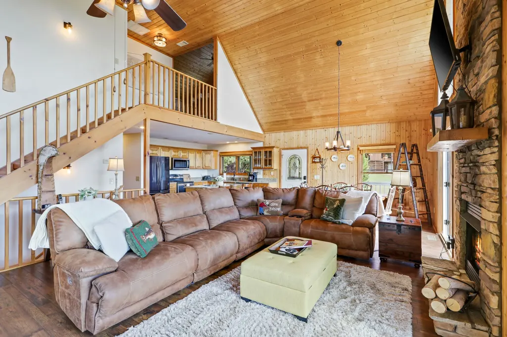 Lofted living room with wooden staircase