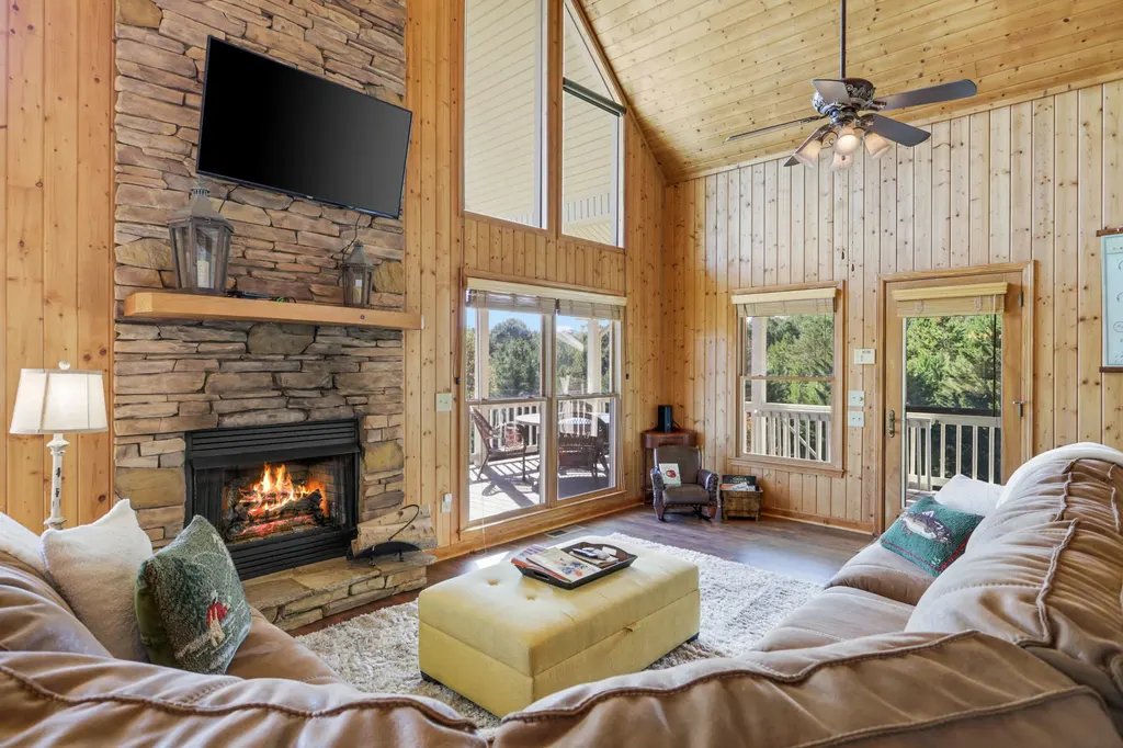 Living room with TV and fireplace