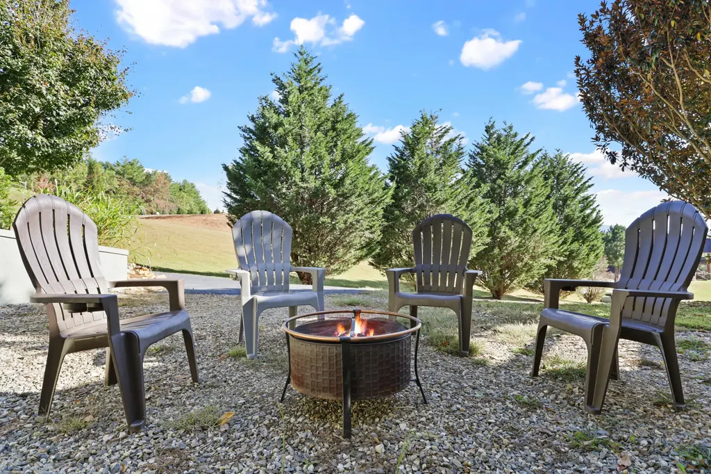 Adirondack chairs around the fire pit