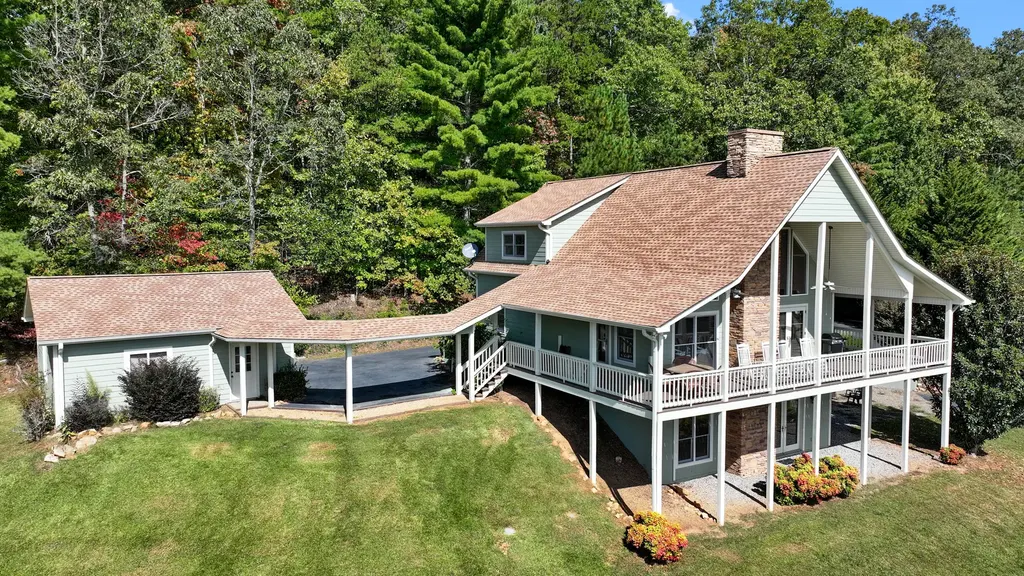 Aerial view of cabin and surrounding lawn